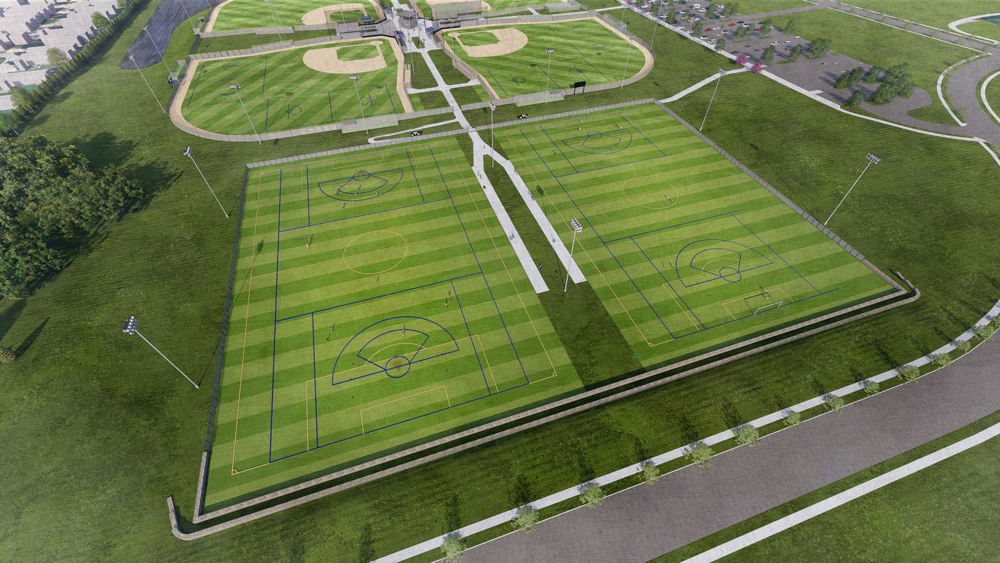 Aerial rendering of the two multipurpose turf fields, marked for soccer and lacrosse, with the diamonds behind them.